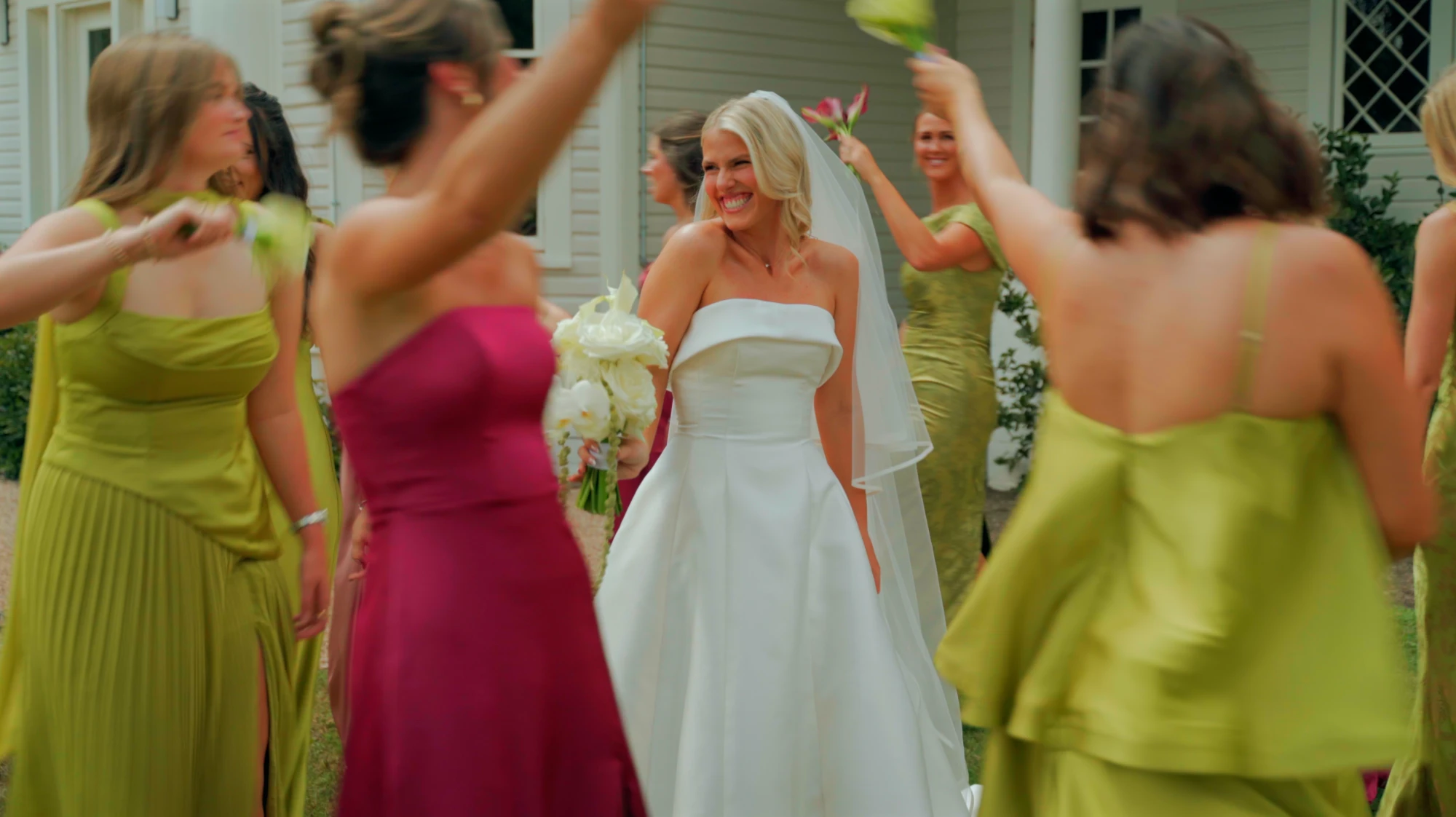 Bride laughing at the bouquet toss