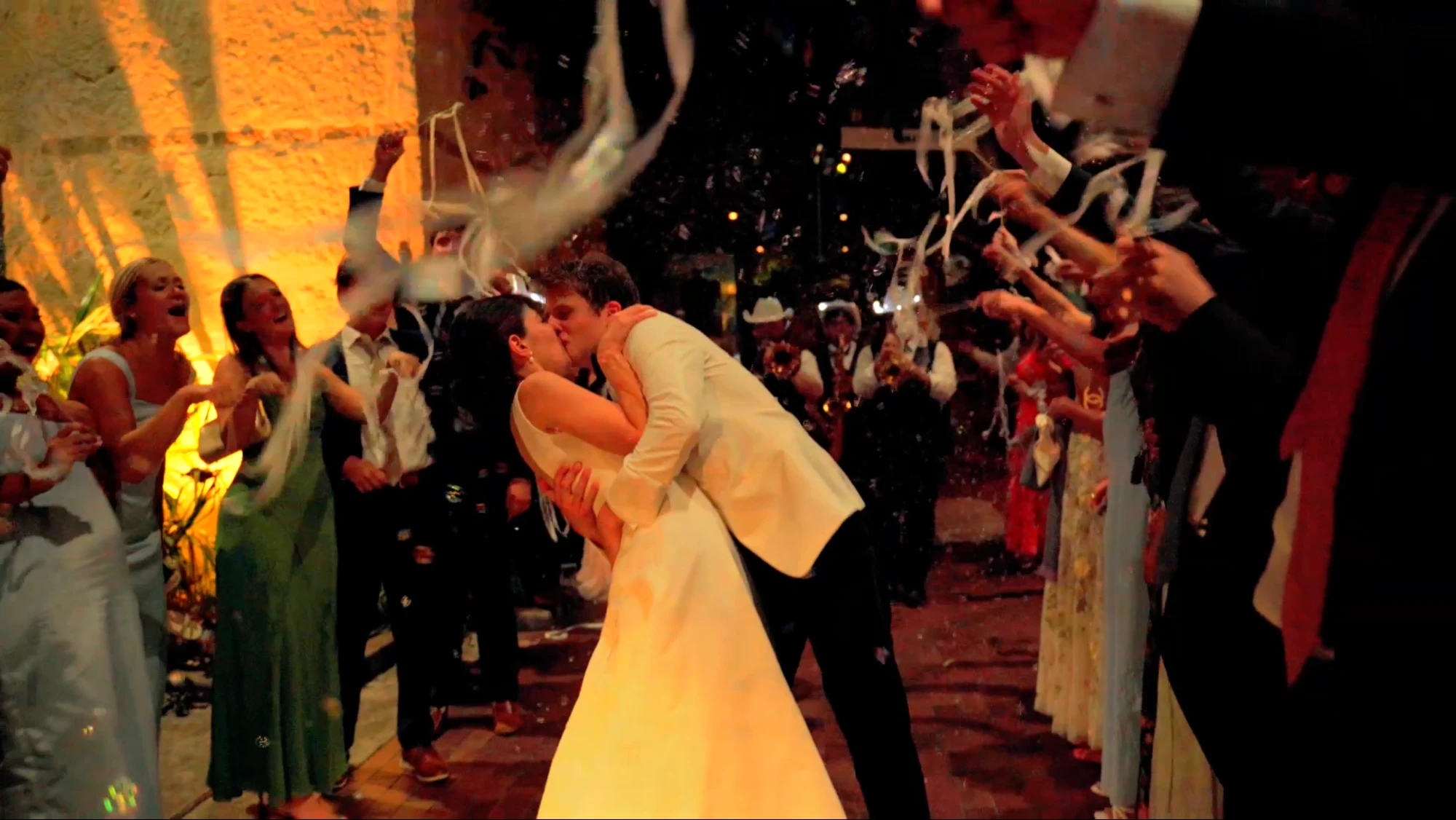 Couple kissing during confetti exit