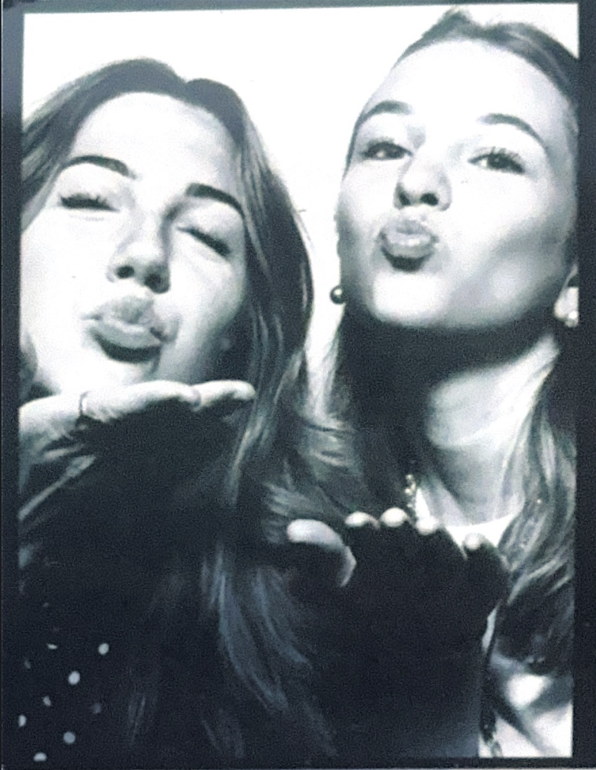 Anabelle and a friend blowing a kiss to the camera